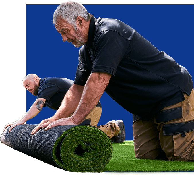 workers unrolling sod